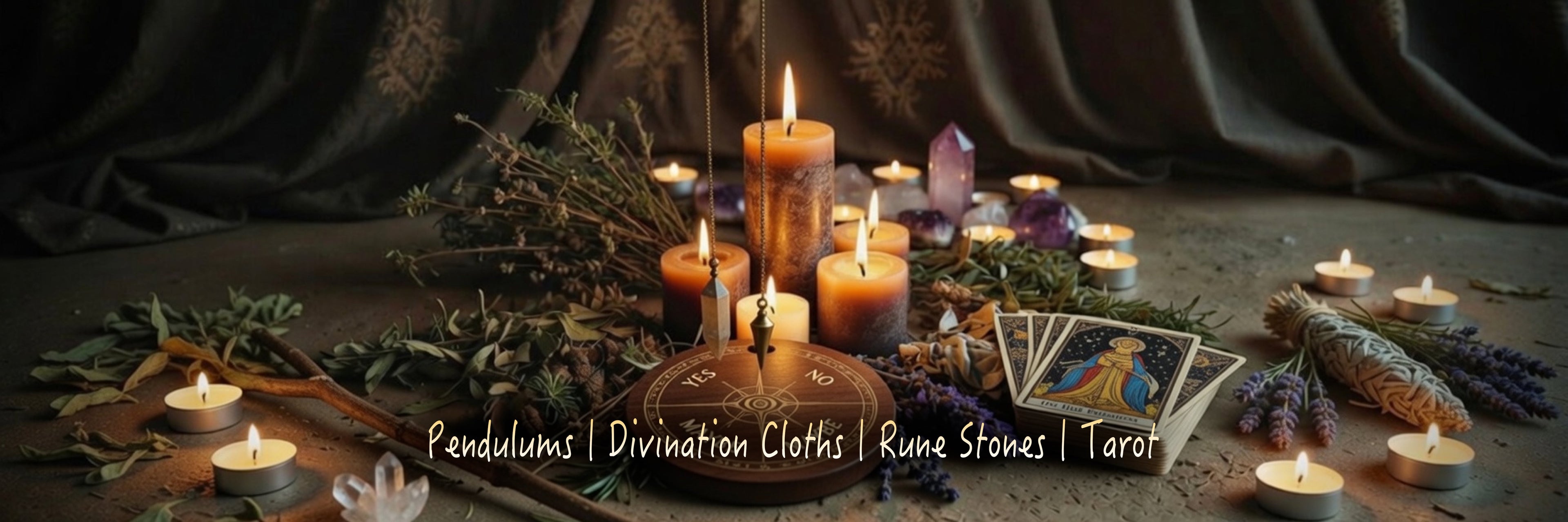 Candlelit scene with divination tools, pendulum, tarot cards and dowsing stick on a dark mystic background