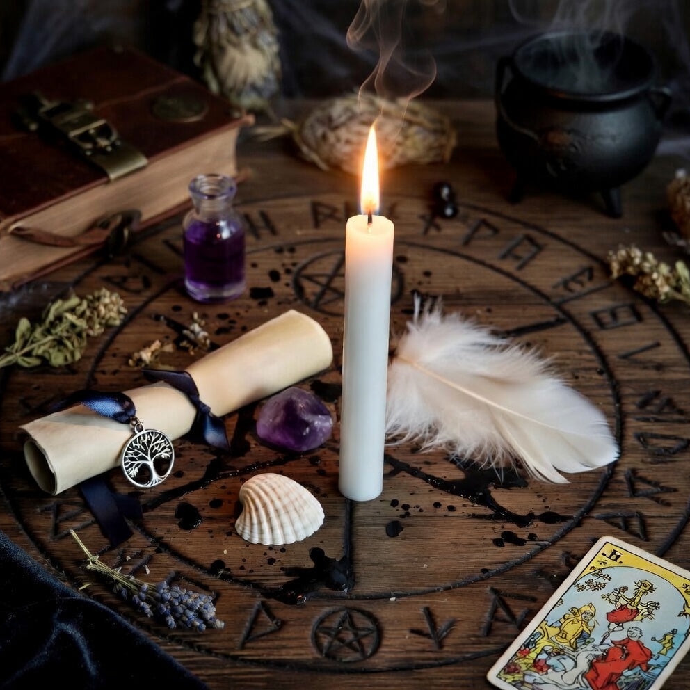 Anxiety spell kit setup with candle, tarot card, and other mysticaland sorcery  items on a wooden circle.
