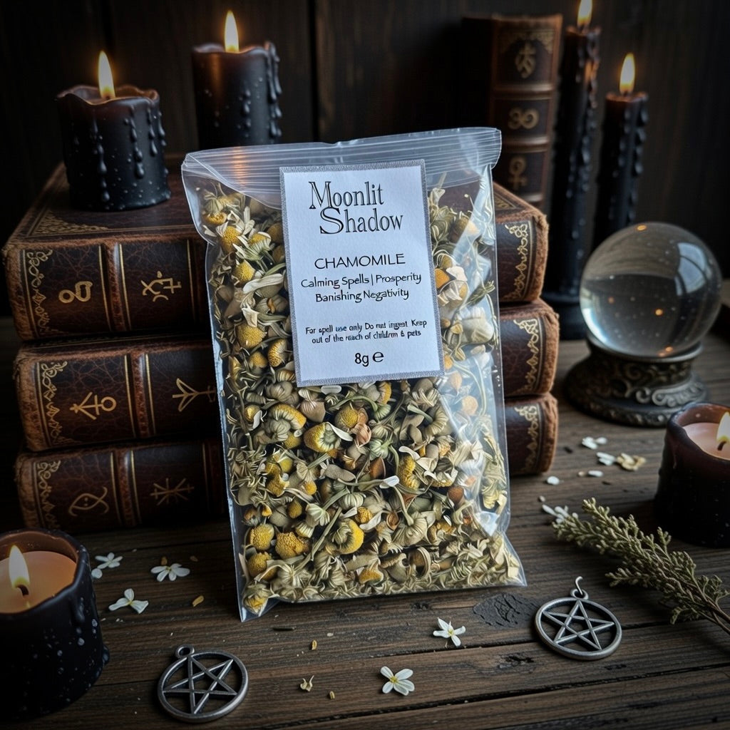 Packaged chamomile with a label on a sorcery themed setting with candles and books.