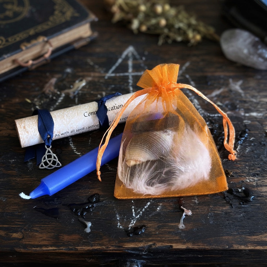 Comminication beginners spell kit, resting on old wood with occult chalk marks