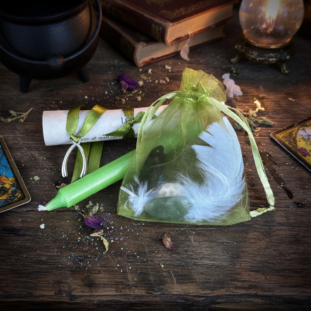 Good luck spell kit on a wooden surface with witchcraft items