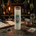 Magic spell candle labeled 'Protection' on a mystical table with herbs, books, and tarot cards.