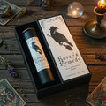 Raven's remedy peace and harmony spell candle with presentation box, on a wooden surface with witchcraft related articles
