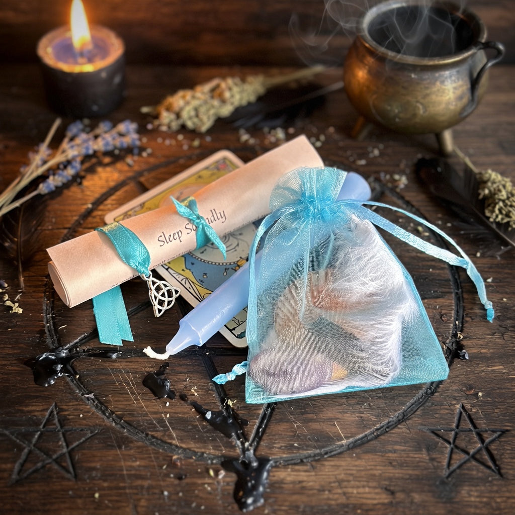 Sleep soundly spell kit with a blue drawstring bag, candles, and herbs on a wooden occult carved surface.