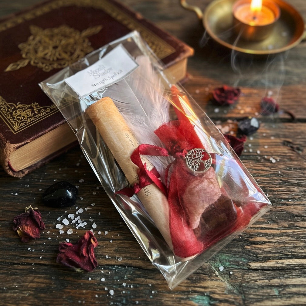Strength spell kit with scroll and red candle, on a wooden surface, with witchcraft related items behind
