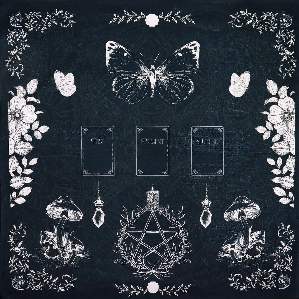 Black tarot reading cloth featuring past, present, and future, with witch's garden design. Skulls, butterflies, flowers and toadstools