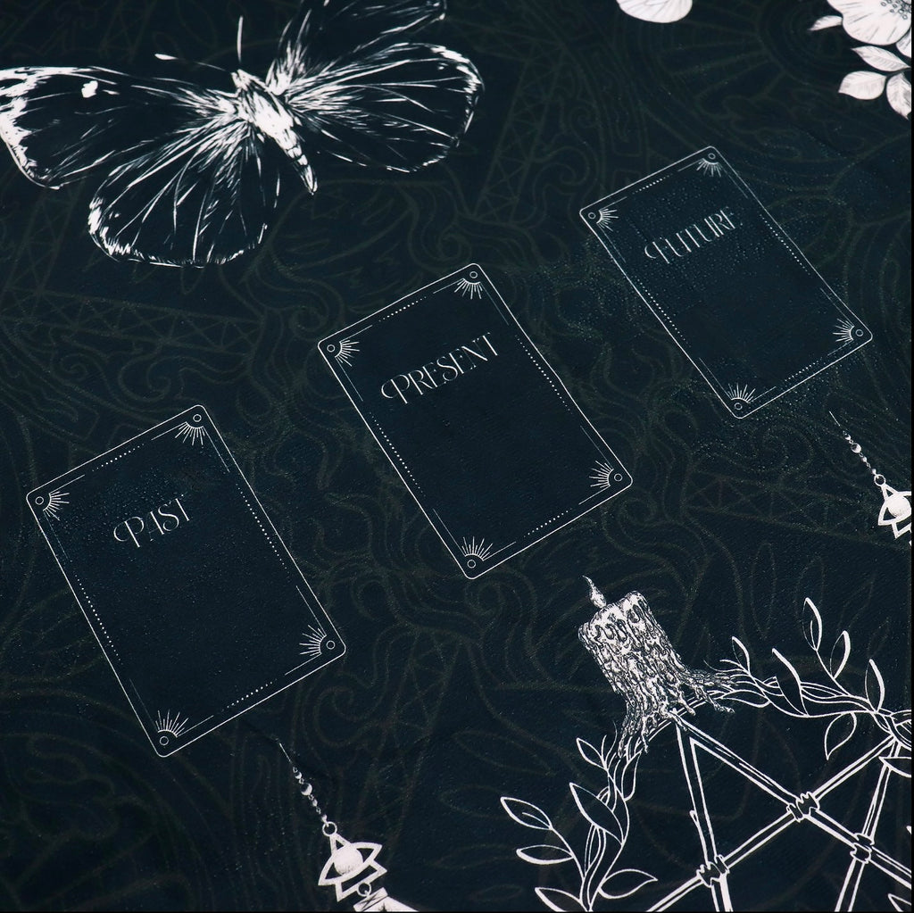 Black tarot reading cloth featuring past, present, and future, with witch's garden design. Skulls, butterflies, flowers and pentagram