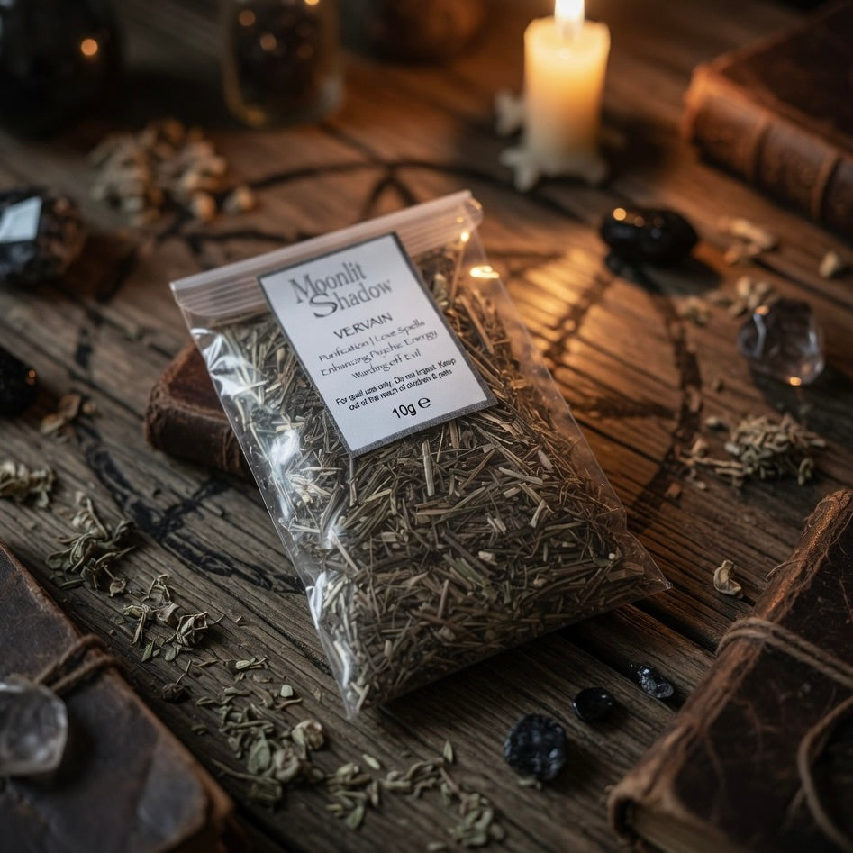 Packaged vervain spell herbs labeled 'Moonlit Shadows' on a wooden surface with candles and other items.
